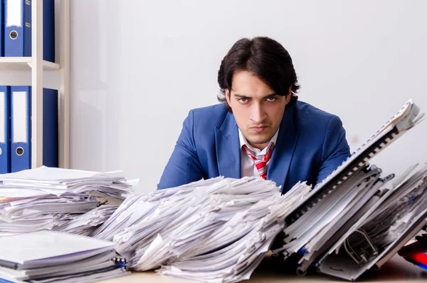 Young businessman employee unhappy with excessive work — Stock Photo, Image