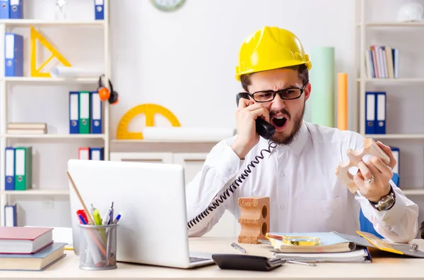 Young male architect working in the office — Stock Photo, Image