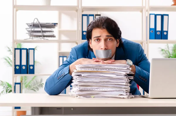 Young male employee with tape on the mouth — Stock Photo, Image