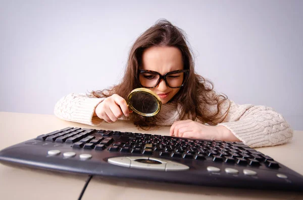 Funny nerd girl working on computer