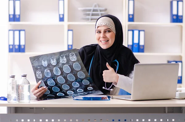 Young doctor in hijab working in the clinic