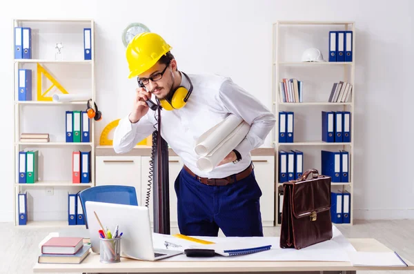 Young male architect working in the office — Stock Photo, Image