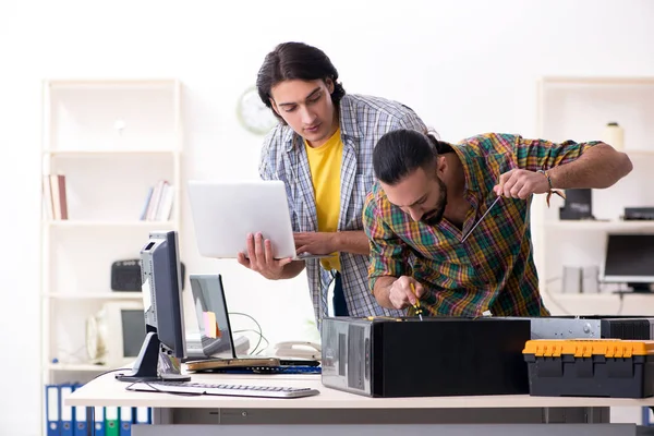 IT engineers working on hardware issue