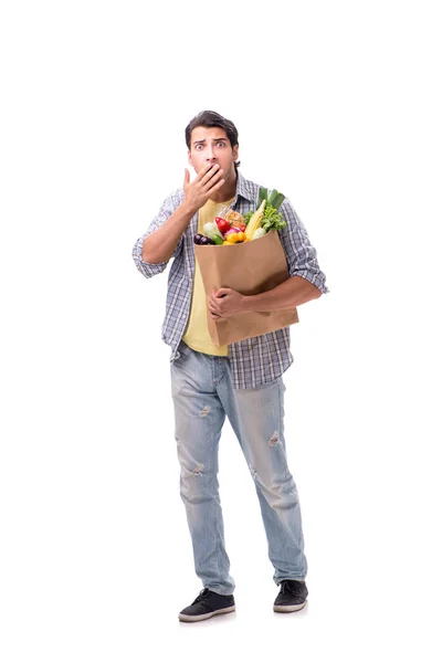 Joven con su tienda de comestibles en blanco —  Fotos de Stock