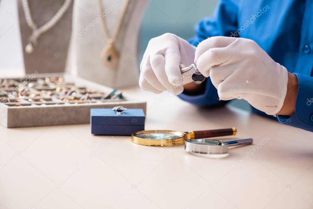 Young jeweler working in his workshop