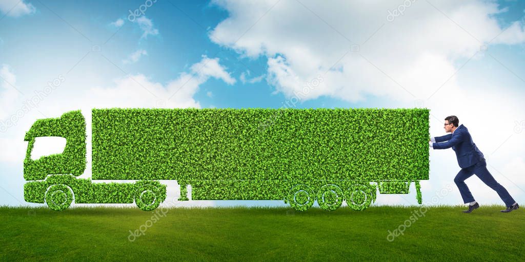 Businessman with green ecological vehicle
