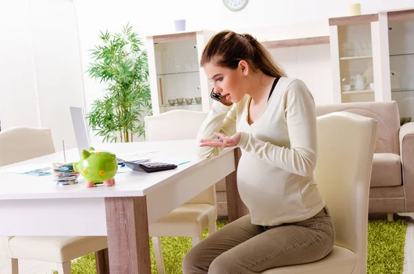 Young pregnant woman in budget planning concept — Stock Photo, Image