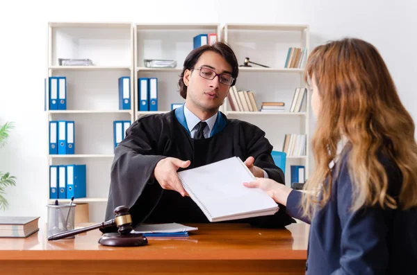 Young woman visiting male lawyer