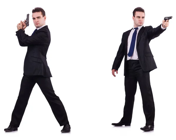 Człowiek w garniturze z pistoletu na białym tle — Zdjęcie stockowe
