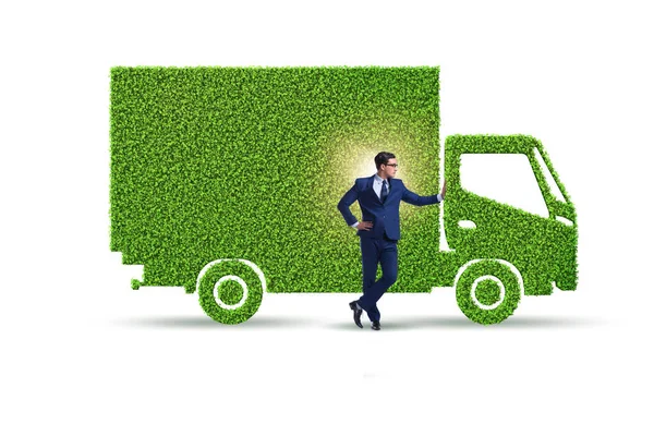 Biznesmen z zielonym ekologicznym pojazdem — Zdjęcie stockowe