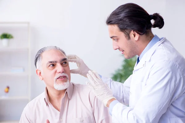 Male patient with hearing problem visiting doctor otorhinolaryng