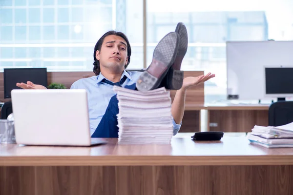 Young employee unhappy with excessive work — Stock Photo, Image