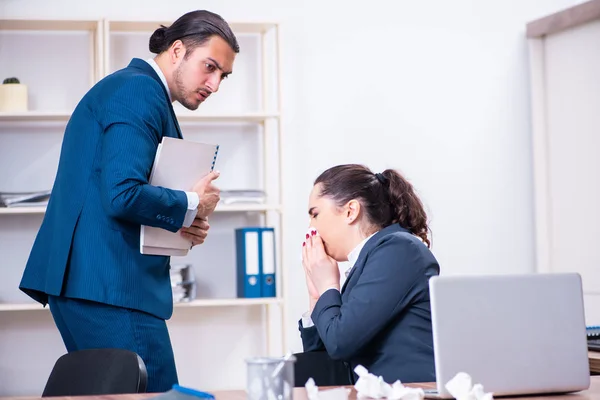 Two employees suffering at workplace — Stock Photo, Image