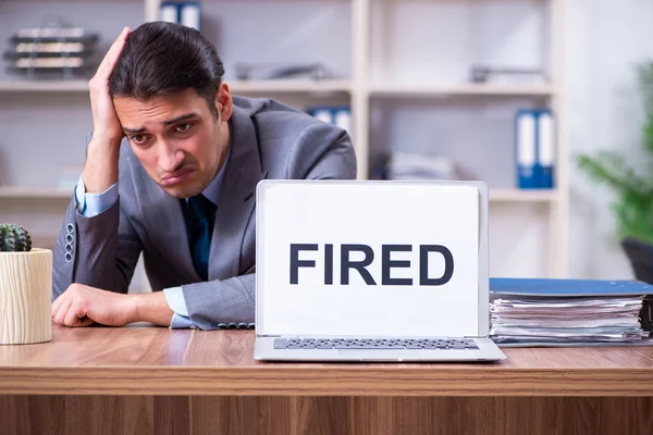 Young male employee being fired from his work — Stock Photo, Image