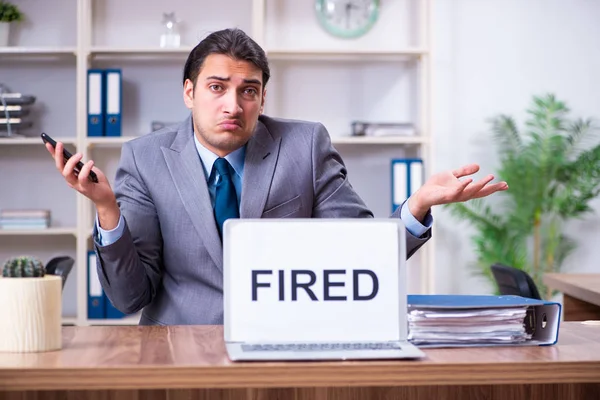 Young male employee being fired from his work — Stock Photo, Image