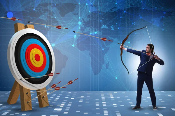 Businessman aiming arrow with bow