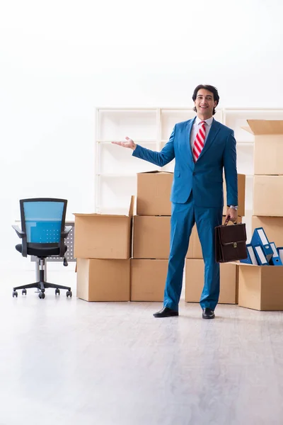 Young handsome businessman moving to new workplace — Stock Photo, Image