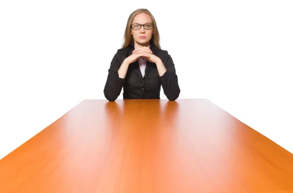 Empleada sentada en mesa larga aislada en blanco — Foto de Stock