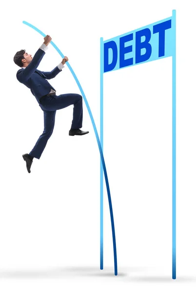 Бизнесмен прыгает с шестом над долгом в бизнес-концепции — стоковое фото