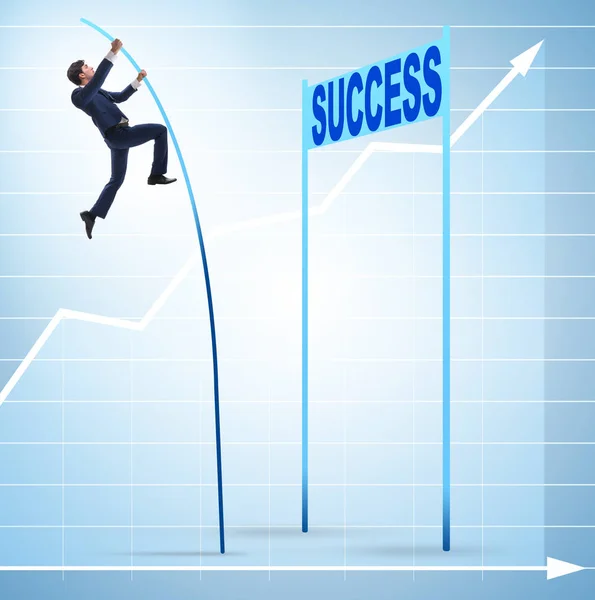 Businessman pole vaulting over towards his success career — Stock Photo, Image