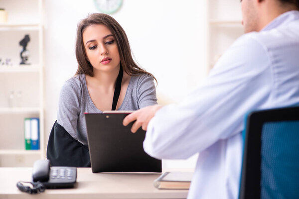 Young male doctor and female beautiful patient 