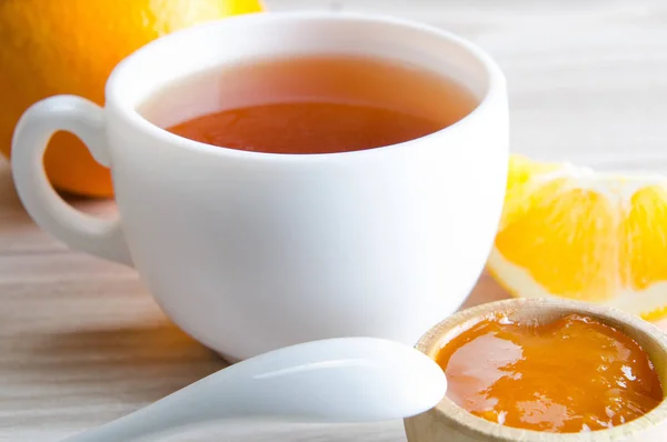 Cup of tea served with orange jam — Stock Photo, Image