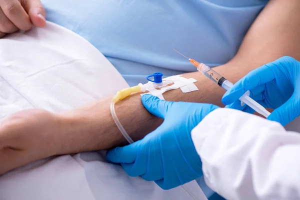 Male patient in blood transfusion concept — Stock Photo, Image