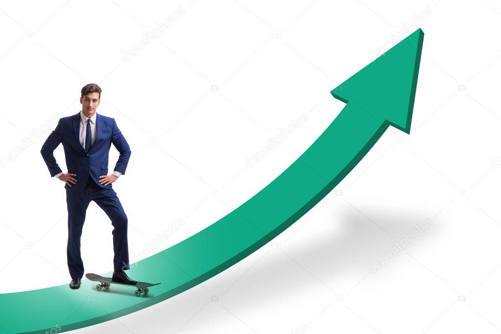 Businessman riding skateboard on financial graph