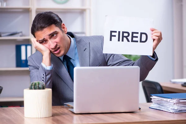 Young male employee being fired from his work — Stock Photo, Image