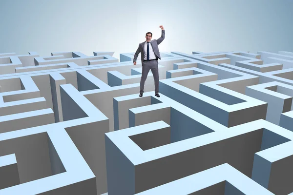 Businessman trying to escape from maze — Stock Photo, Image