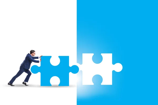 Concept of businessman with missing jigsaw puzzle piece — Stock Photo, Image