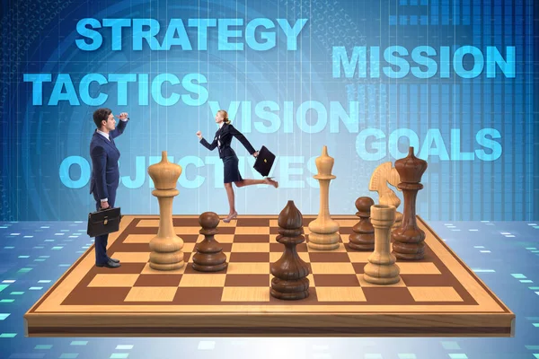 Businessman in large chess board in strategy concept — Stock Photo, Image