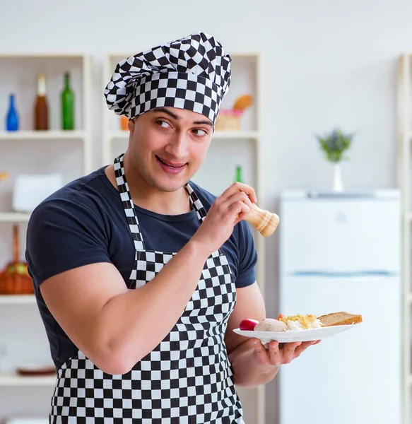 Chef cook cooking a meal breakfast dinner in the kitchen — Stock Image Chef cook cooking a meal breakfast dinner in the kitchen Royalty Free Stock Images