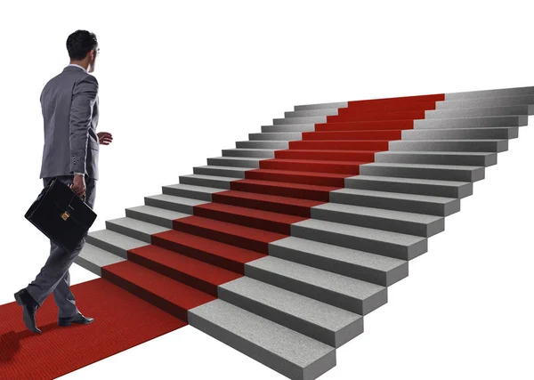 Joven empresario subiendo escaleras y alfombra roja sobre fondo blanco — Foto de Stock