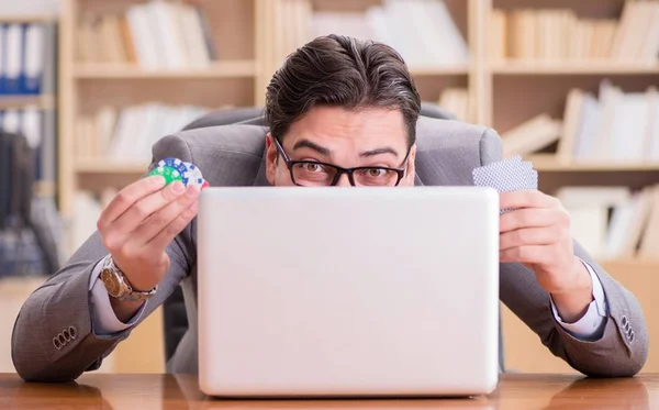 Businessman gambling playing cards at work — Stock Photo, Image