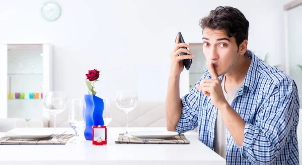 Man alone preparing for romantic date with his sweetheart Stock Photo