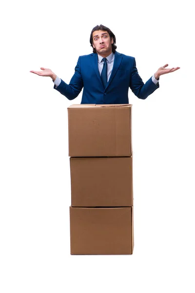 Ung manlig anställd med lådor isolerade på vitt — Stockfoto