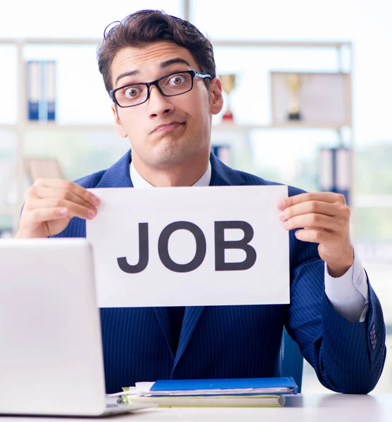 Businessman with message in the office at desk — Stock Photo, Image