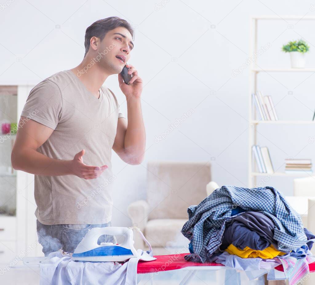 The inattentive husband burning clothing while ironing