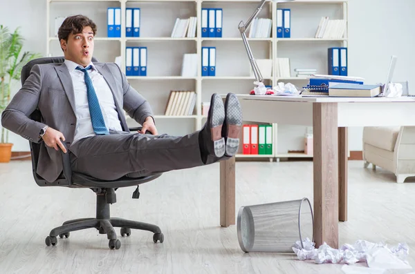 Businessman having fun taking a break in the office at work