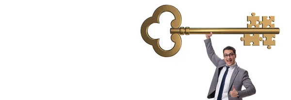 Üzletember kulccsal és kirakós darabokkal — Stock Fotó