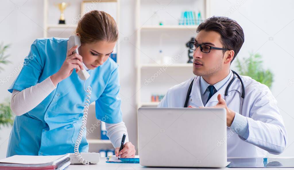 The male and female doctor having discussion in hospital
