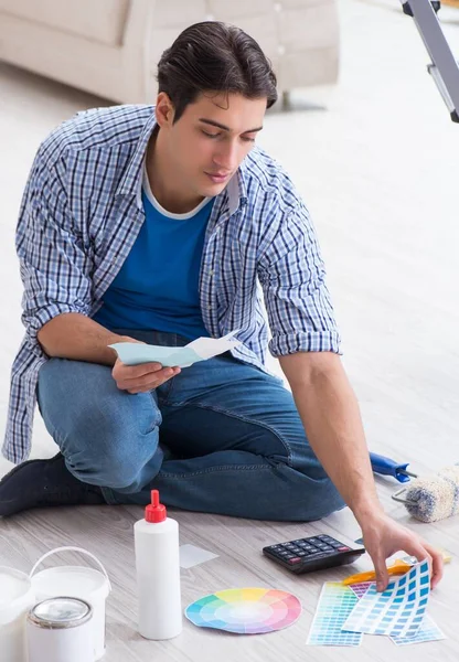 Young man overspending his budget in refurbishment project — Stock Photo, Image