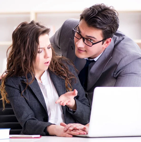 Unhappy boss having a chat with his secretary — Stock Photo, Image