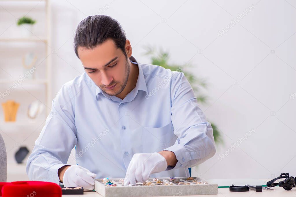 Young male jeweler at workshop