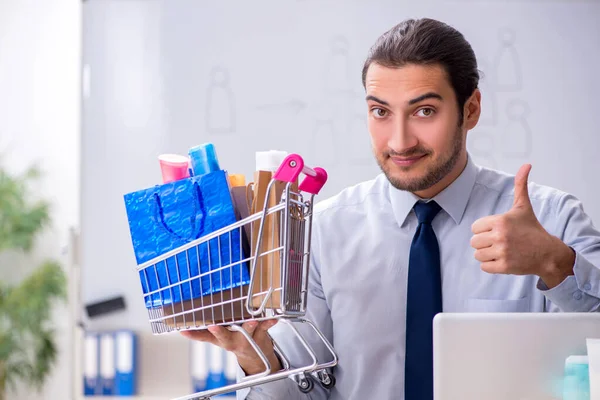 Young male shopaholic in e-commerce concept — Stock Photo, Image