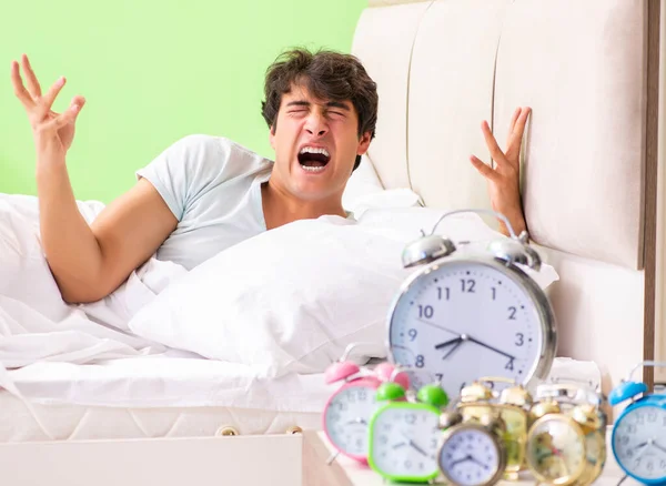 Young man having trouble waking up in early morning — Stock Photo, Image