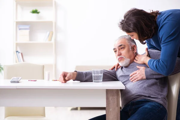 Grandfather and grandson in first aid concept — Stock Photo, Image