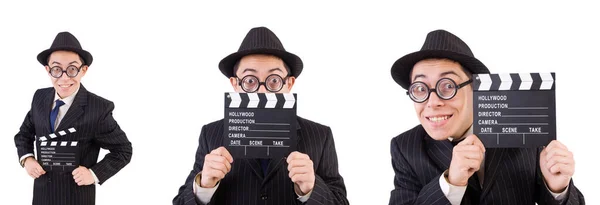 Hombre divertido en traje elegante con tablero de película aislado en blanco —  Fotos de Stock