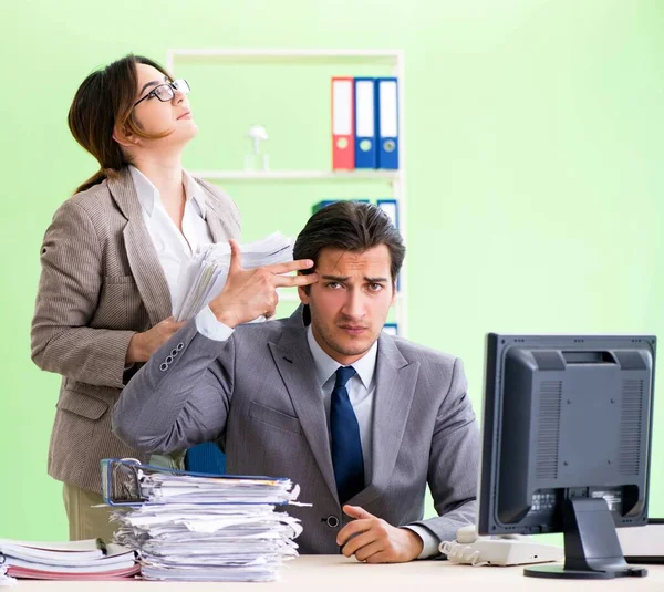 Man employee suffering from excessive work — Stock Photo, Image